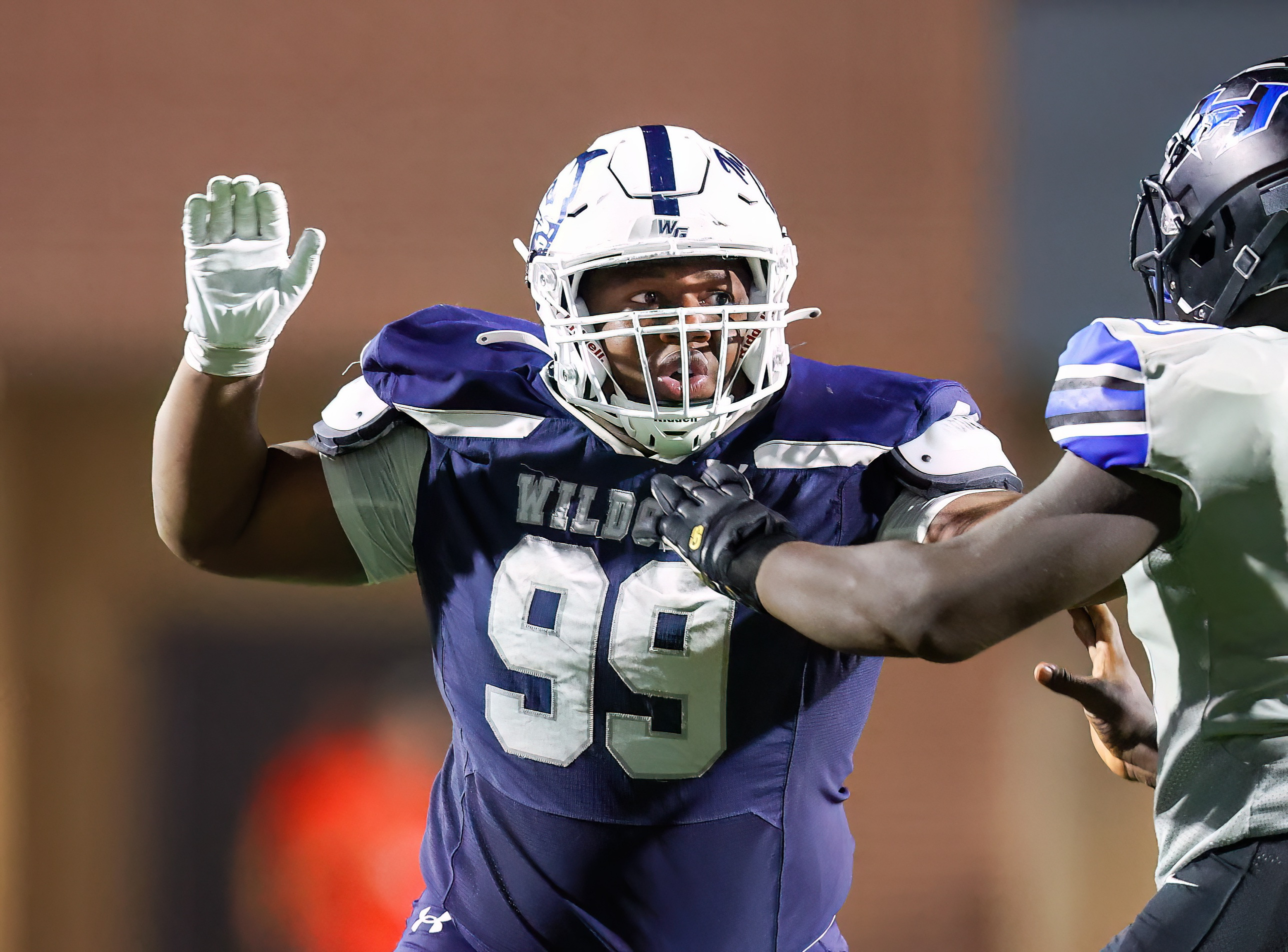 Kristopher Williams rushing with a hand up against Hebron